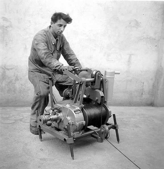 Worker operating a winch